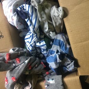 A bundle of newborn boy clothes